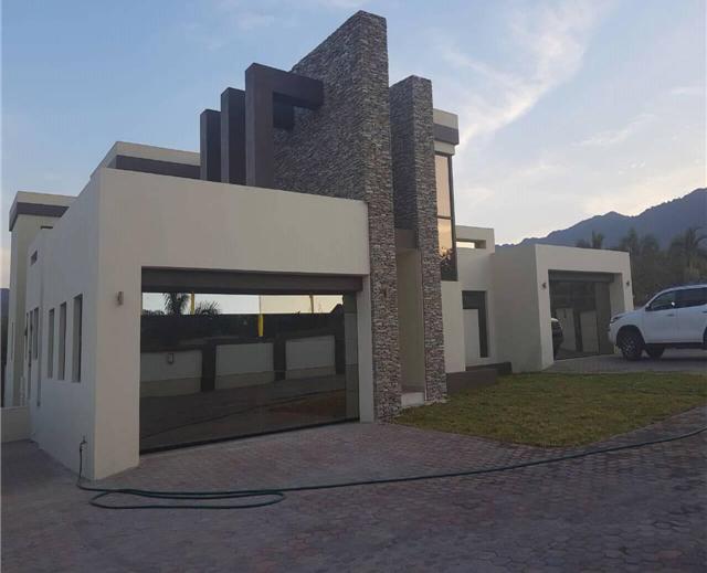 Residential frameless glass garage door