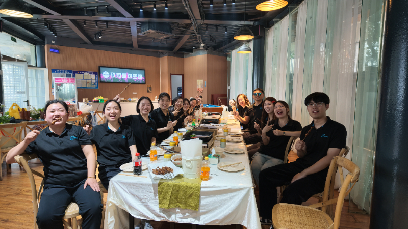 The whole Master Well team is having a BBQ together.