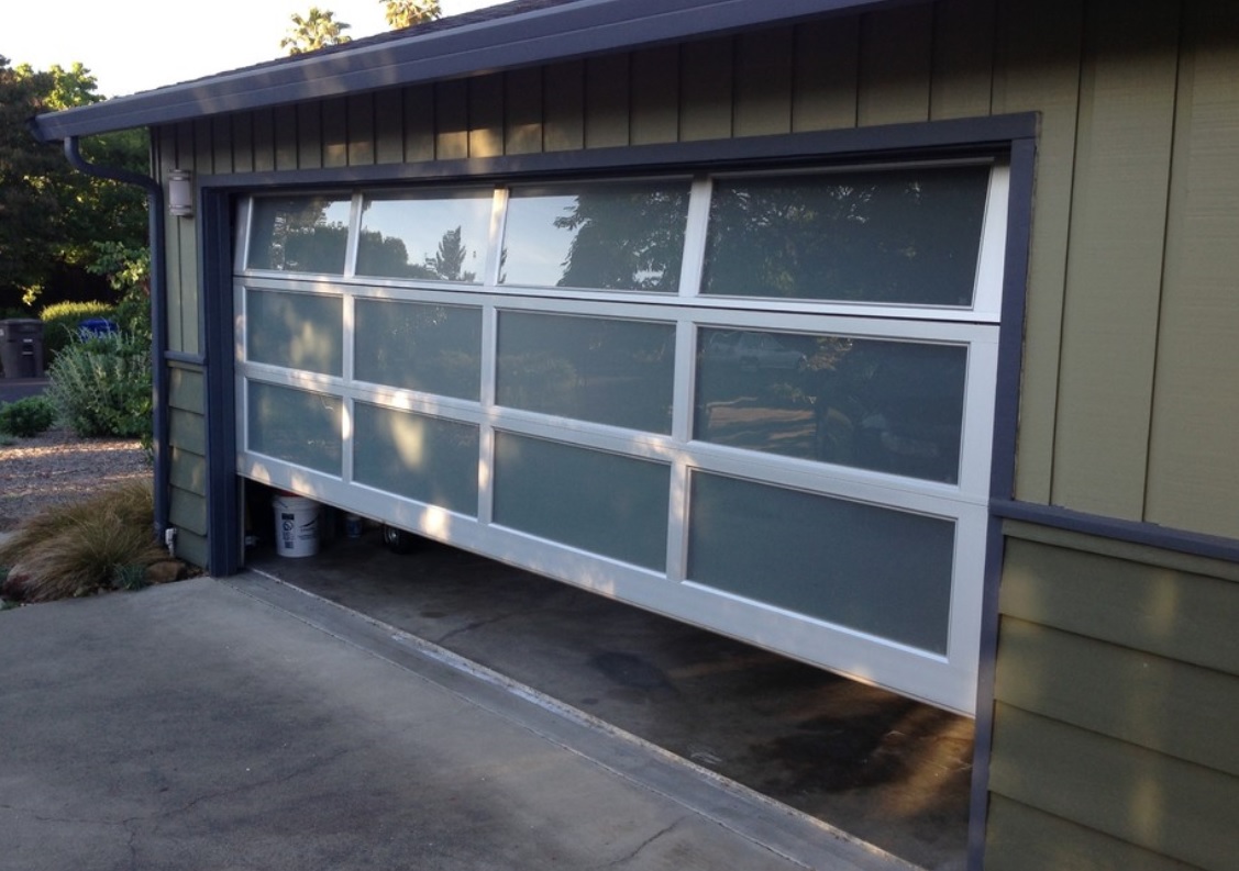 What does the panel material of aluminium garage door have?